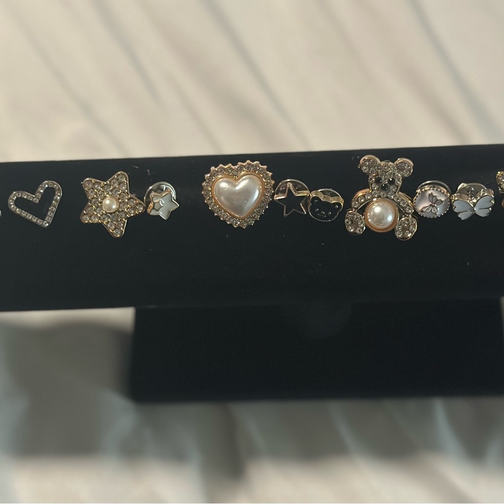 Assorted Gold and Silver Brooches Set with Heart and Star Accents